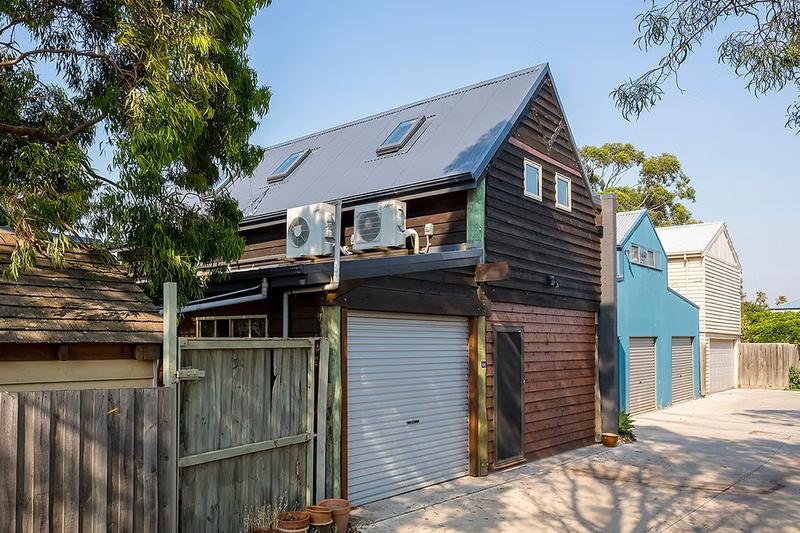 Outside of garage conversion showing air con units
