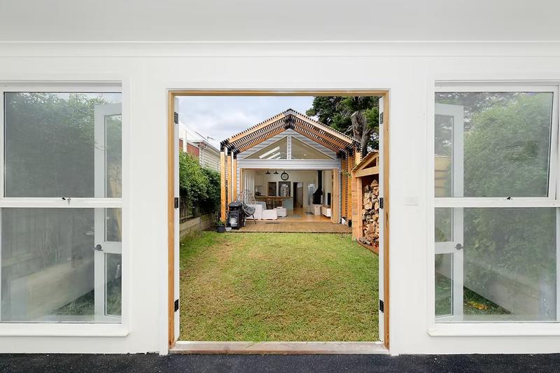 View of house from backyard studio secondary building