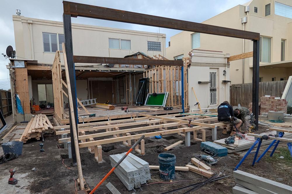 Extension being added to existing house by builders