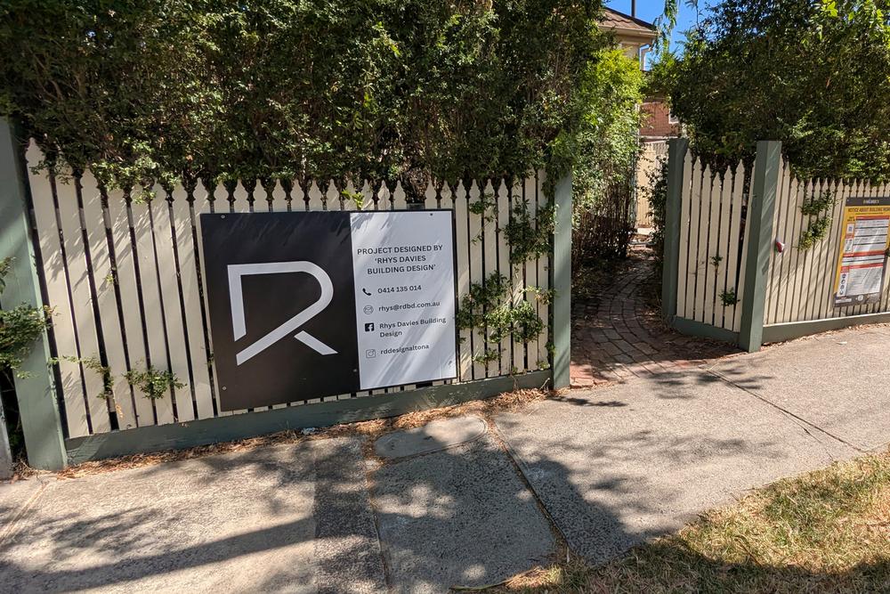 RD Building Design signage on a picket fence